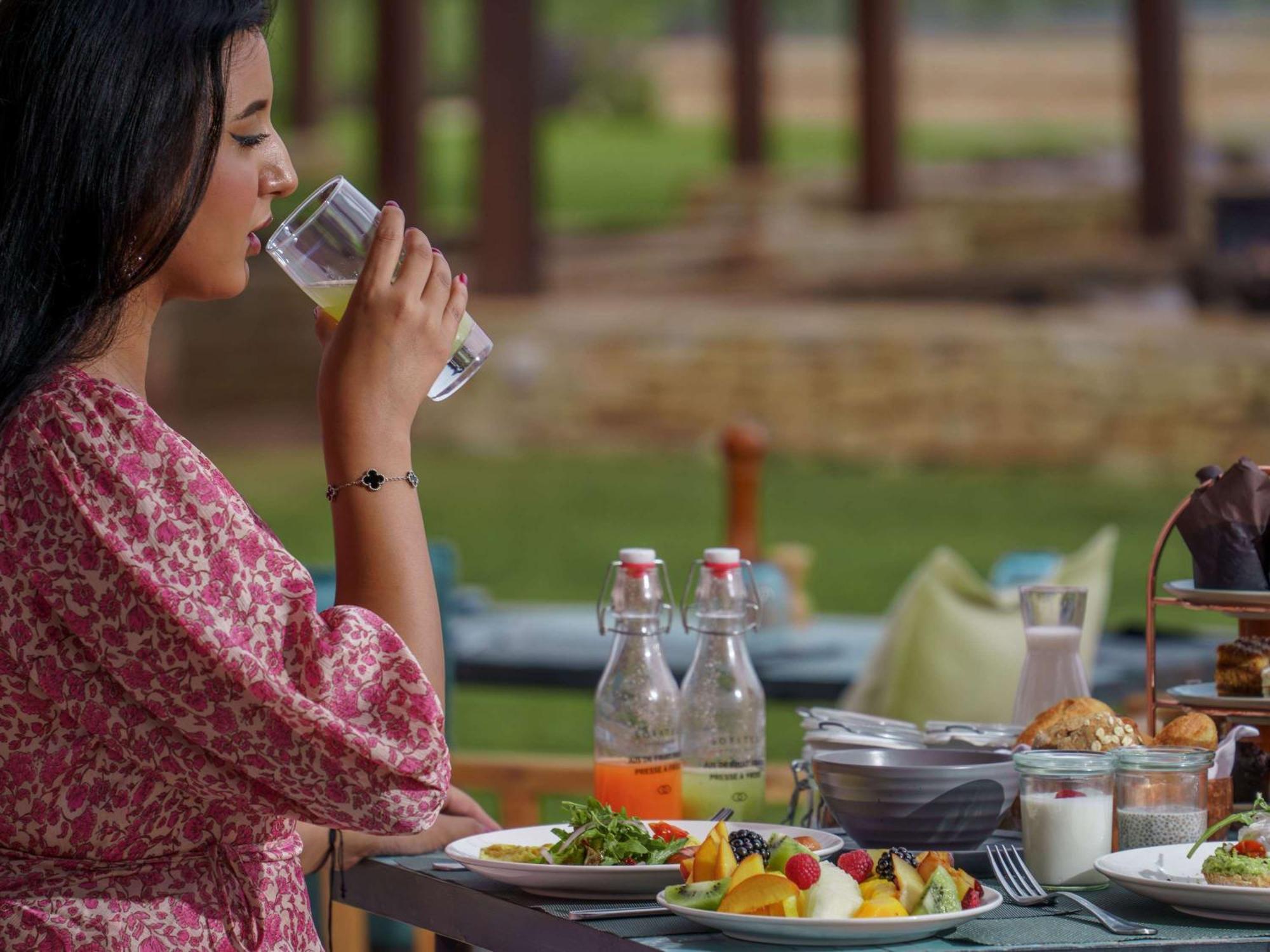 Sofitel Agadir Royal Bay Resort Exterior photo A woman drinking water